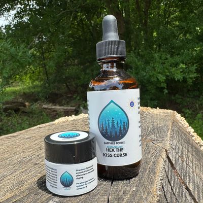 HEX THE KISS CURSE Usnea barbata balm jar next to the companion tincture bottle - Sapphire Forest Botanicals (Mushroom Mountain)